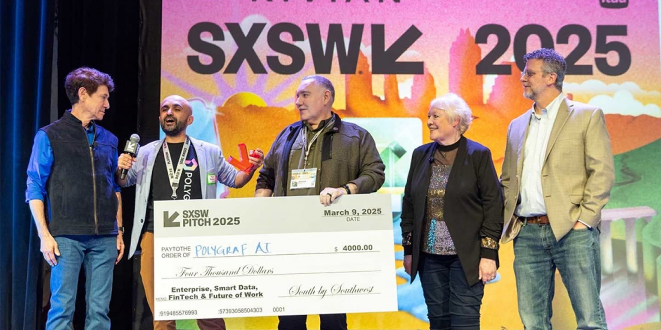 Polygraf team accepting an oversized SXSW Pitch 2025 award cheque on stage